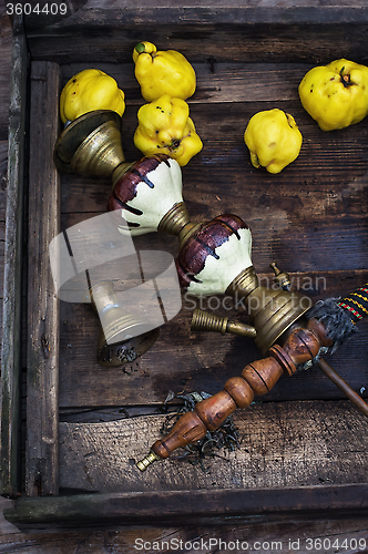 Image of Still life with retro hookah and quince