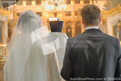 Image of Young pair gets married in church