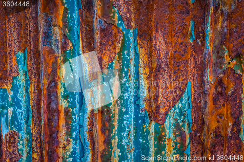 Image of Rusty wall surface with blue paint