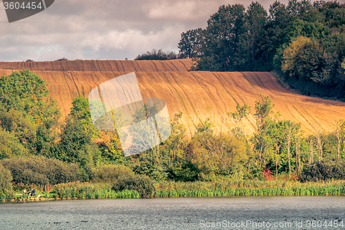 Image of Agricultural hillside fields above a lake