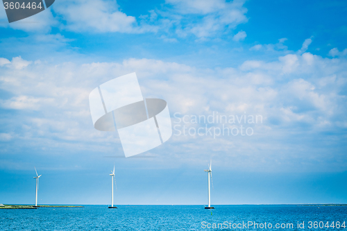 Image of Windmills in the blue ocean
