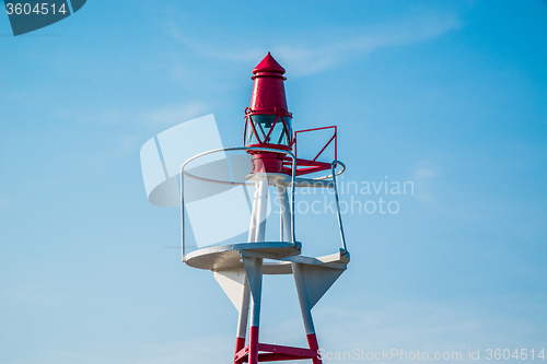 Image of Small lighthouse on blue sky