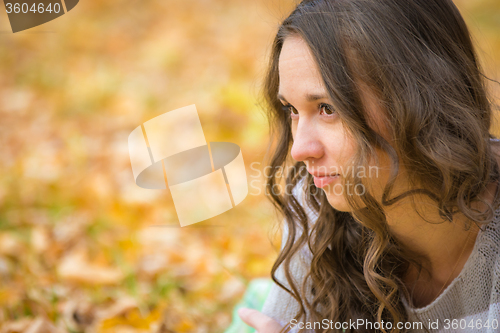 Image of Close-up portrait of a beautiful young girl looking to the left