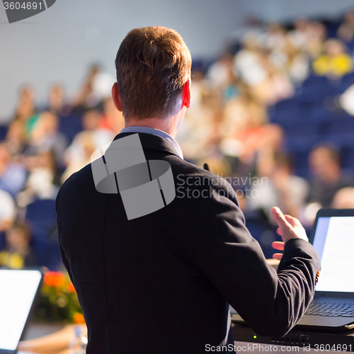 Image of Speaker at Business Conference and Presentation.