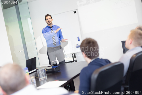 Image of Business man making a presentation in office on job interview. 