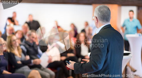 Image of Speaker at Business Conference and Presentation.