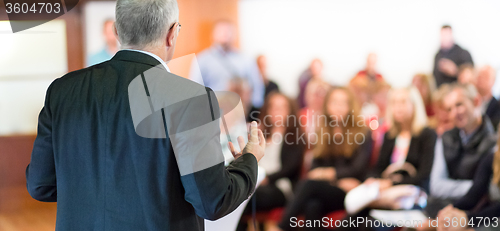 Image of Speaker at Business Conference and Presentation.