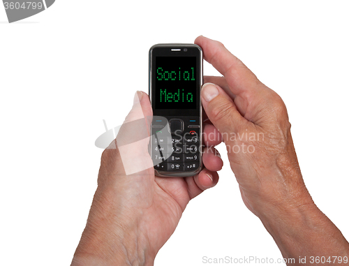 Image of Hands of senior woman with a mobile phone