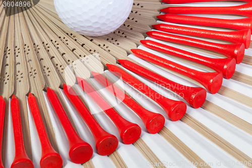 Image of Typical Japanese hand fan made of bamboo and golf equipments