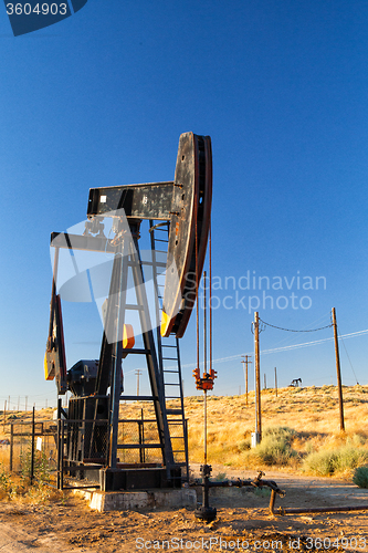 Image of Working oil pump in desert