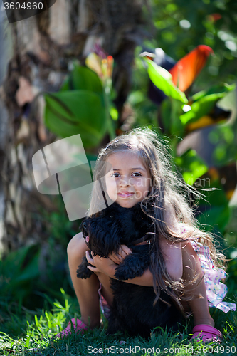 Image of Little girl with dog