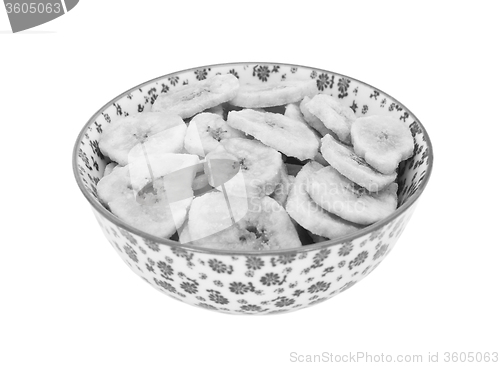 Image of Dried banana chips in a china bowl
