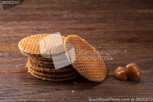 Image of Waffles with caramel on wood