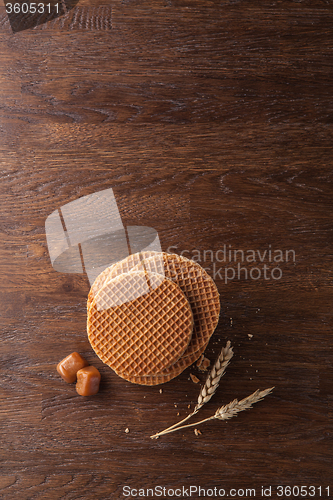 Image of Waffles with caramel on wood