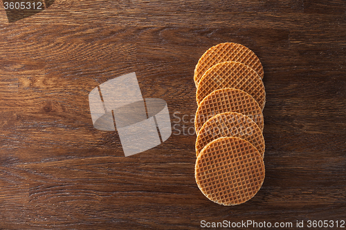 Image of Waffles with caramel on wood