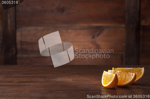 Image of Orange slices on wood