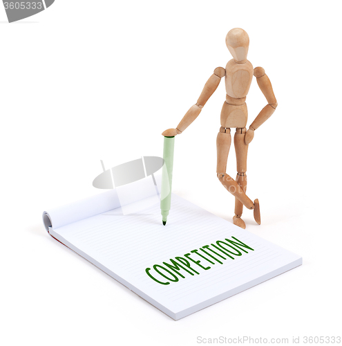 Image of Wooden mannequin writing - Competition