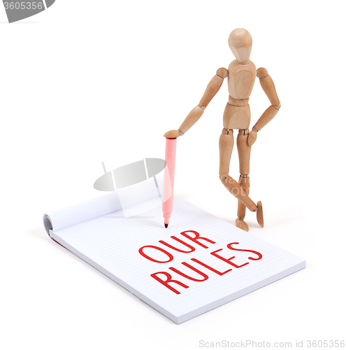 Image of Wooden mannequin writing - Our rules
