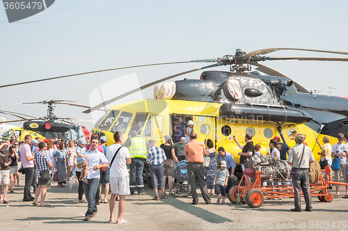 Image of People explore the MI-10K helicopter