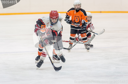 Image of Game between children ice-hockey teams