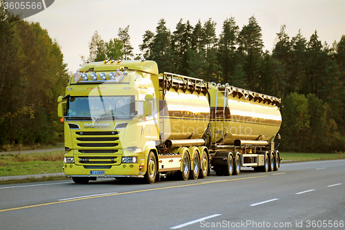 Image of Yellow Scania R580 Tank Truck on the Road in Evening