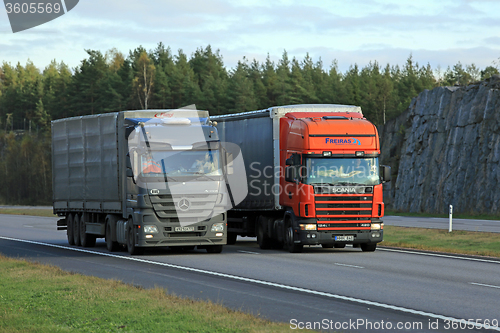 Image of Scania Semi Truck Overtakes another Truck