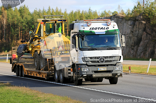Image of White Mercedes-Benz Actros Hauls Road Maintenance Equipment
