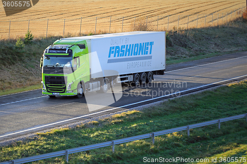 Image of Lime Green Volvo FH Semi Truck on Motorway