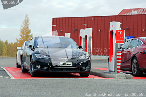 Image of Tesla Model S Cars at a Supercharger Station