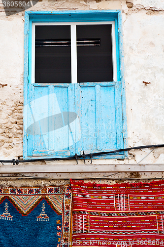 Image of blue window in morocco  and brown   carpet