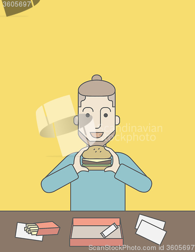Image of Man eating hamburger. 