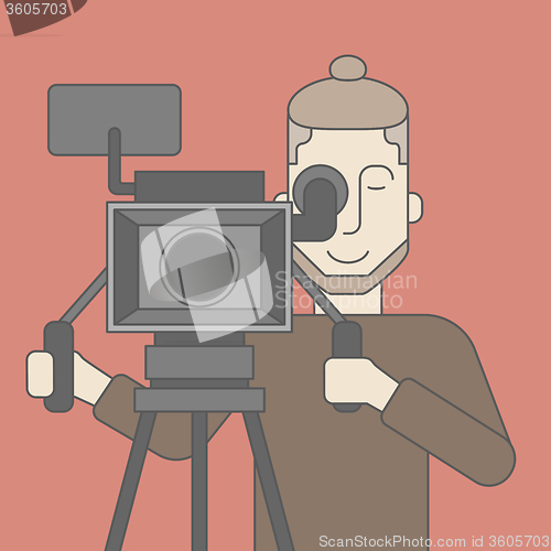 Image of Cameraman with beard looking through movie camera