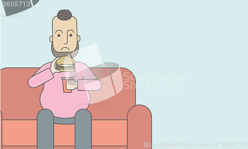 Image of Man eating hamburger. 