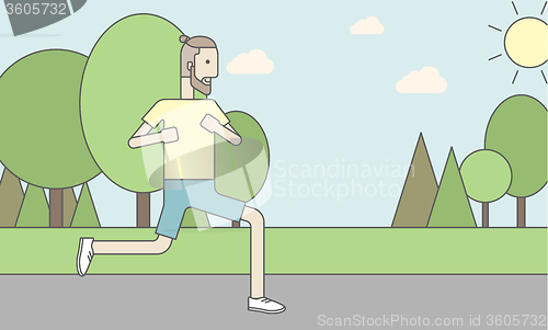 Image of Caucasian hipster man jogging in the park
