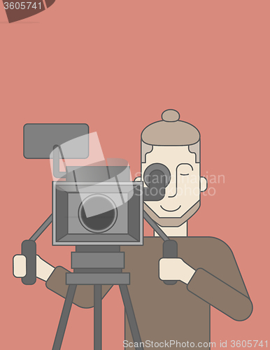 Image of Cameraman with beard looking through movie camera