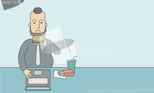 Image of Man eating hamburger. 