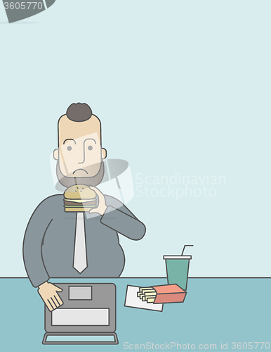 Image of Man eating hamburger. 