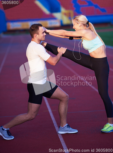 Image of sporty woman on athletic race track