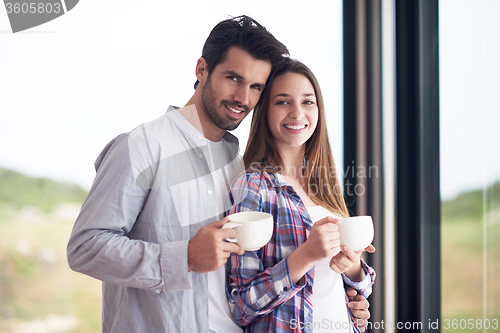 Image of relaxet young couple drink first morning coffee