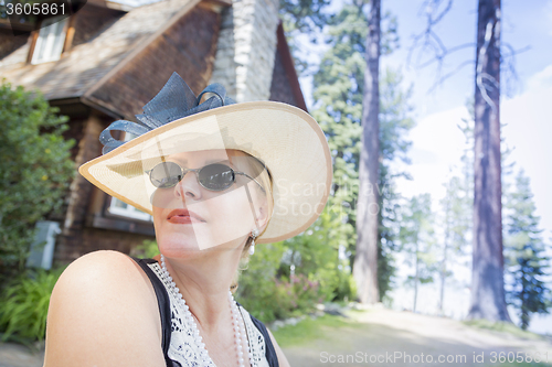 Image of 1920s Dressed Woman Near Antique House