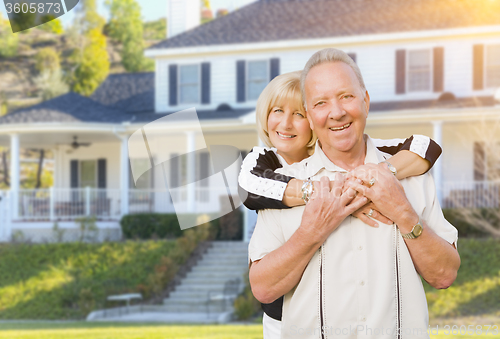 Image of Happy Senior Couple in Front Yard of House