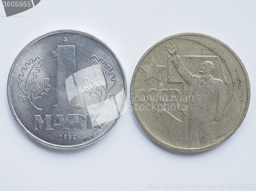 Image of Vintage Russian ruble coin and German mark coin