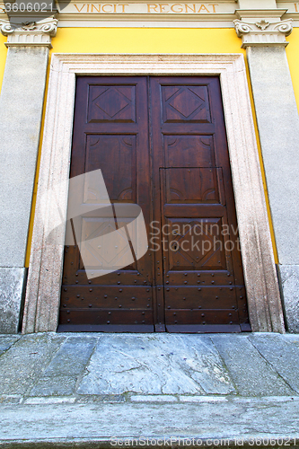 Image of  italy  lombardy     in   milano old   church  door closed brick