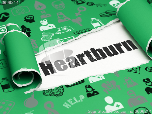 Image of Healthcare concept: black text Heartburn under the piece of  torn paper