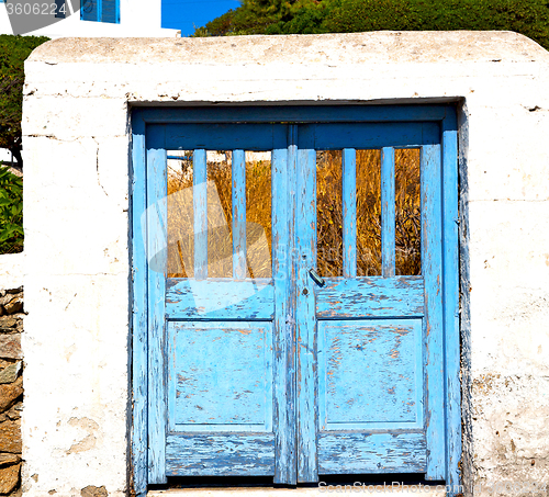 Image of blue door in antique village santorini greece europe and    whit