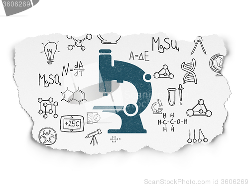 Image of Science concept: Microscope on Torn Paper background