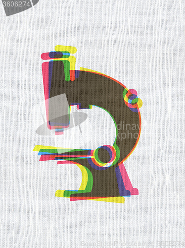 Image of Science concept: Microscope on fabric texture background