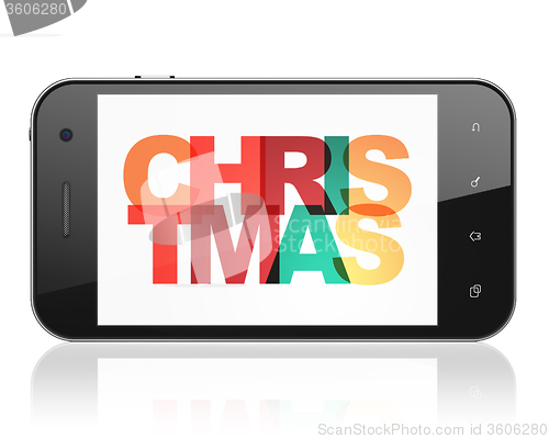 Image of Entertainment, concept: Smartphone with Christmas on  display