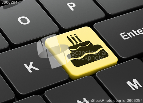 Image of Holiday concept: Cake on computer keyboard background