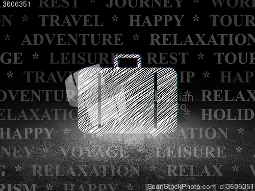 Image of Travel concept: Bag in grunge dark room
